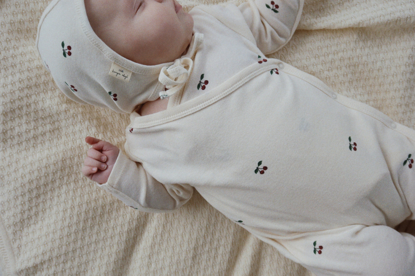 Konges Sloejd newborn helmet gots- cherry ( sold with onesie only)