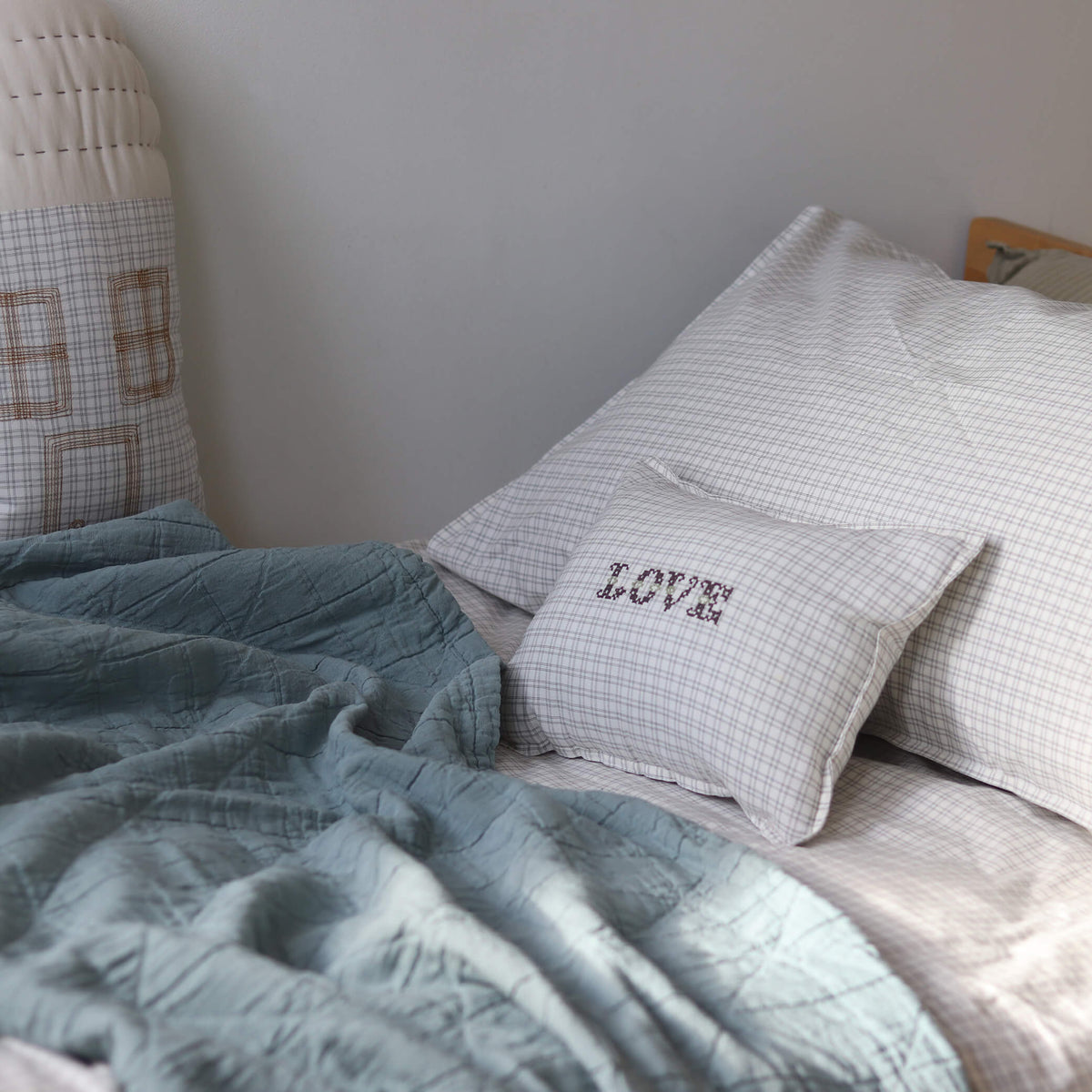 Camomile London grid check cushion