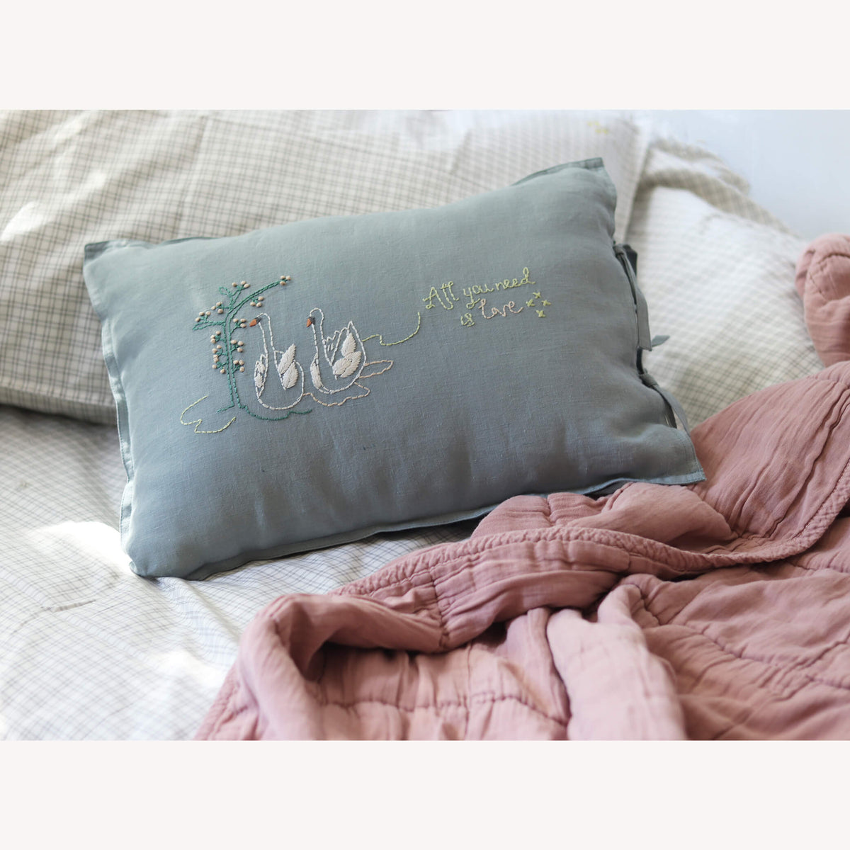Camomile London swan embroidered cushion