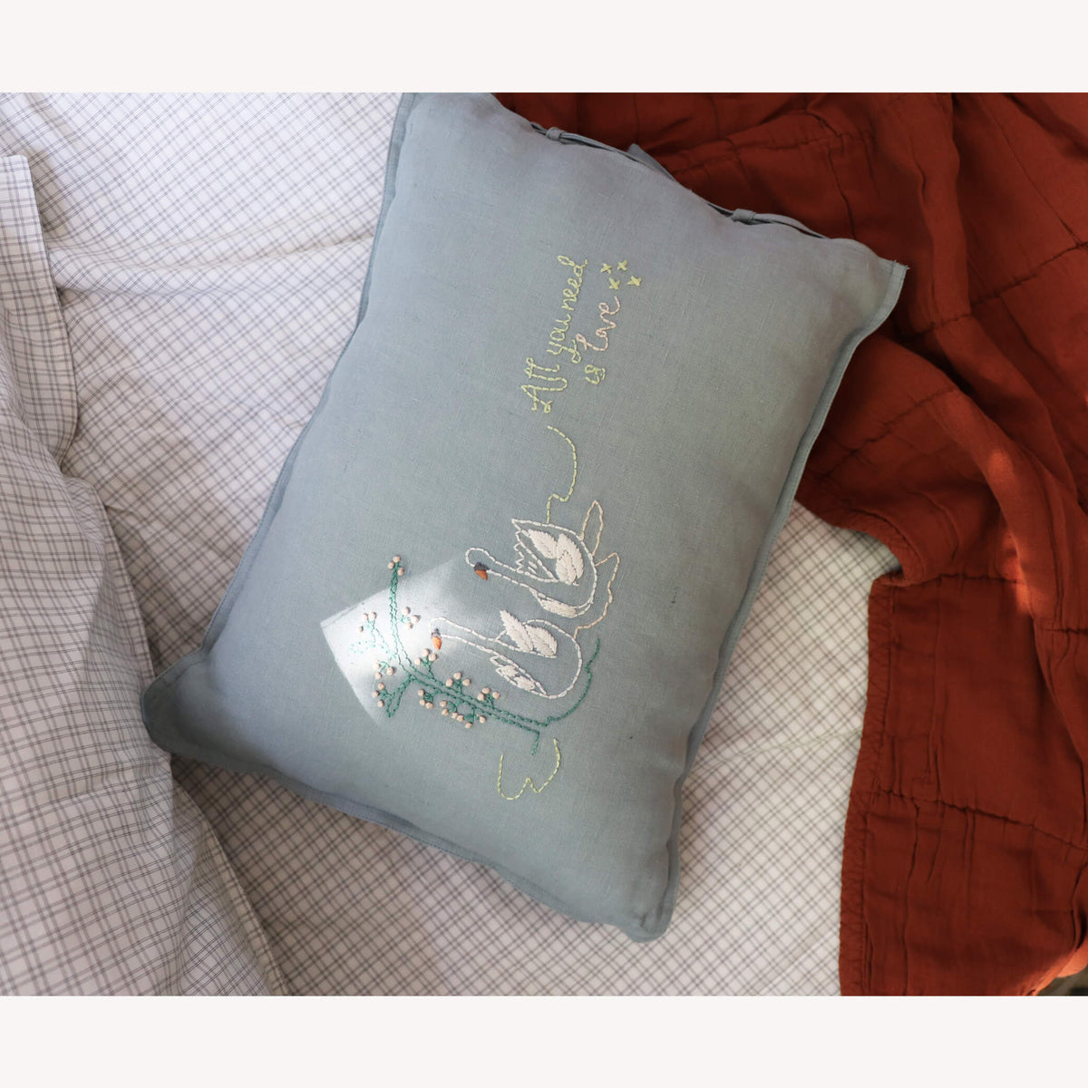 Camomile London swan embroidered cushion