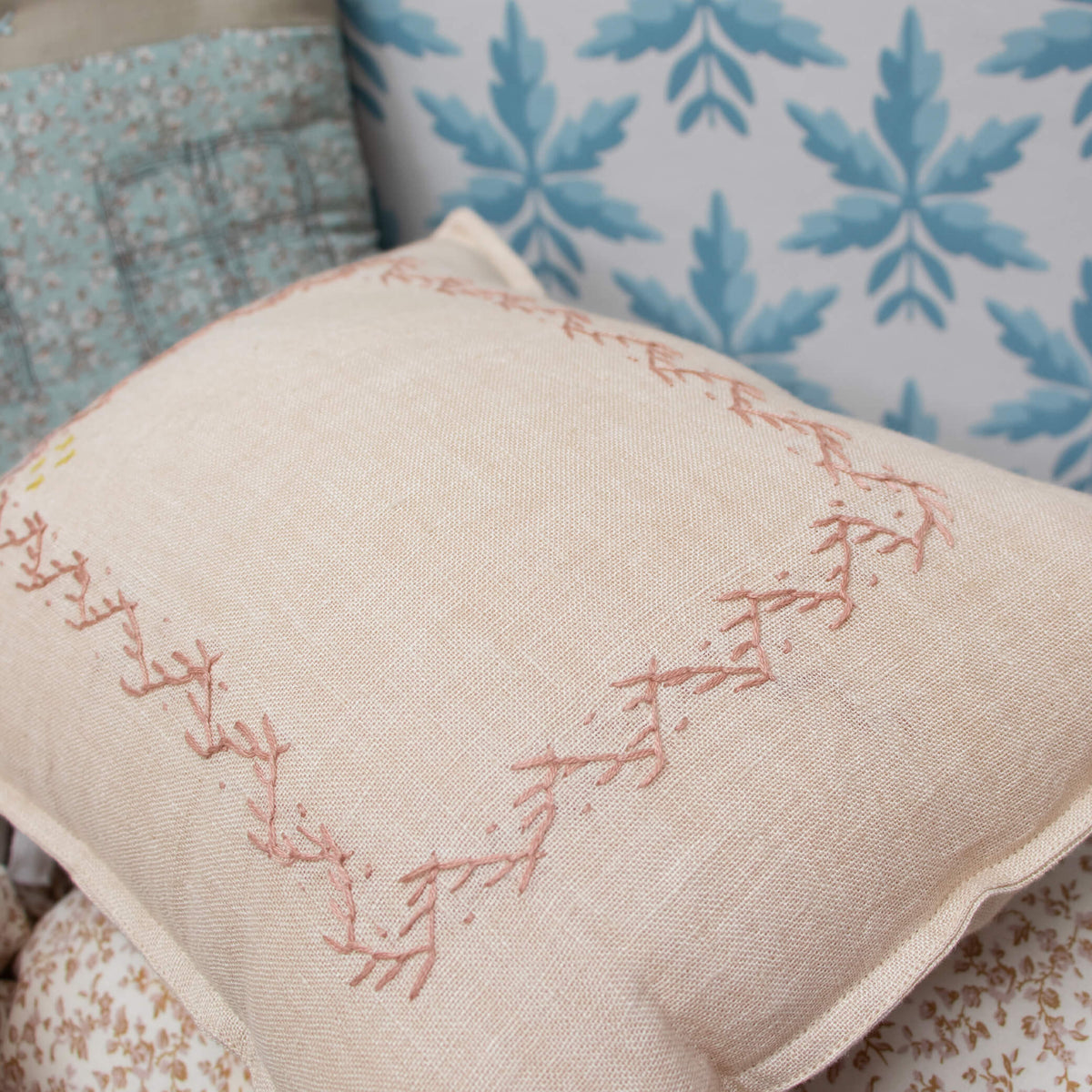 Camomile London hand embroidered zig zag cushion