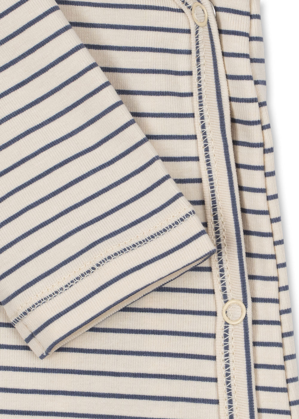 Close-up of Konges Sloejd Stripe Combo onesie snap closure