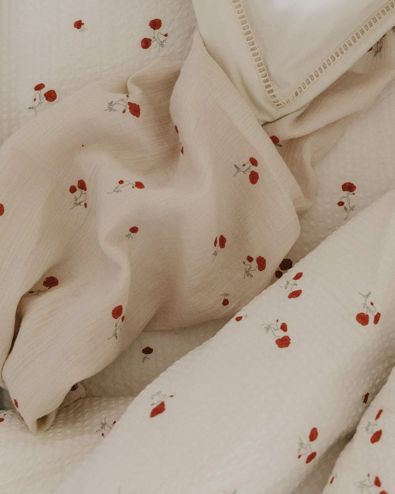Garbo and friends Poppy swaddle blanket