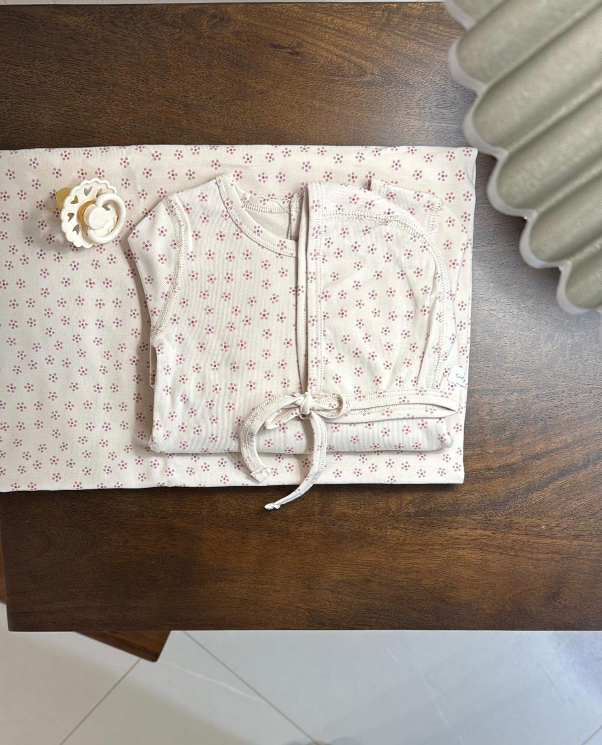Lovely Littles Pink Roseberry romper and hat styled with blanket