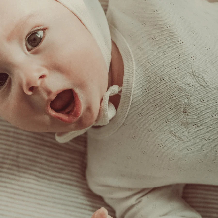 Lovely Littles Oatmilk Pointelle romper detail