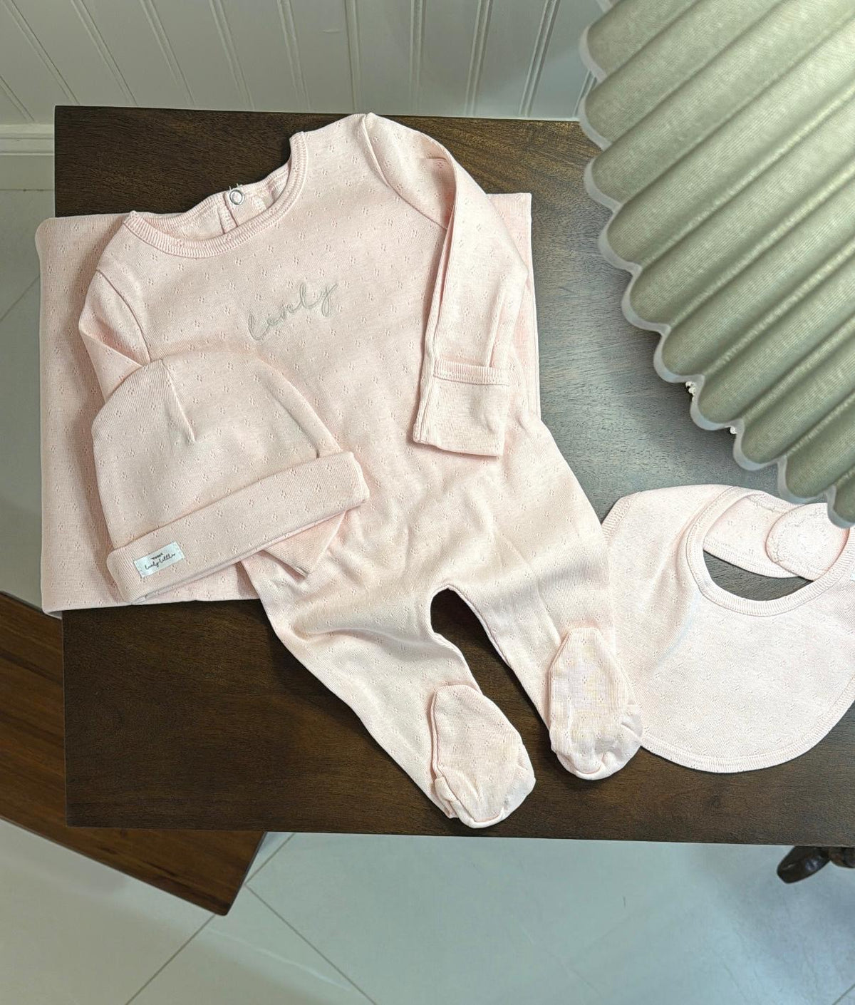 Lovely Littles Tea Rose Pointelle Blanket styled with matching babywear